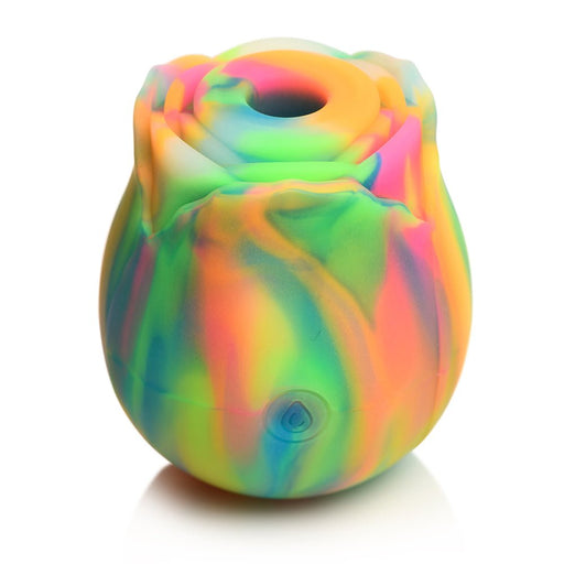 Rainbow-colored silicone rose-shaped clit stimulator with a central suction hole and power button on the front.