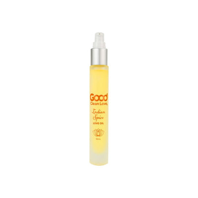 Good Clean Love Indian Spice Love Oil 10mL spray bottle with yellow liquid and silver pump top on white background.