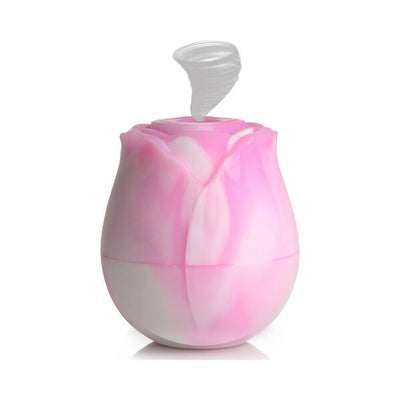 Pink and white silicone clitoral vibrator shaped like a rose with a suction feature on top.