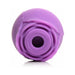 Purple silicone clitoral suction stimulator with a rose-inspired design and central suction opening.