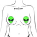 Illustration of green glitter alien face pasties applied on a stylized female chest outline.