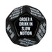 Black 12-sided dice showing party dares like order a drink in slow motion and dance the robot for bachelor party game.