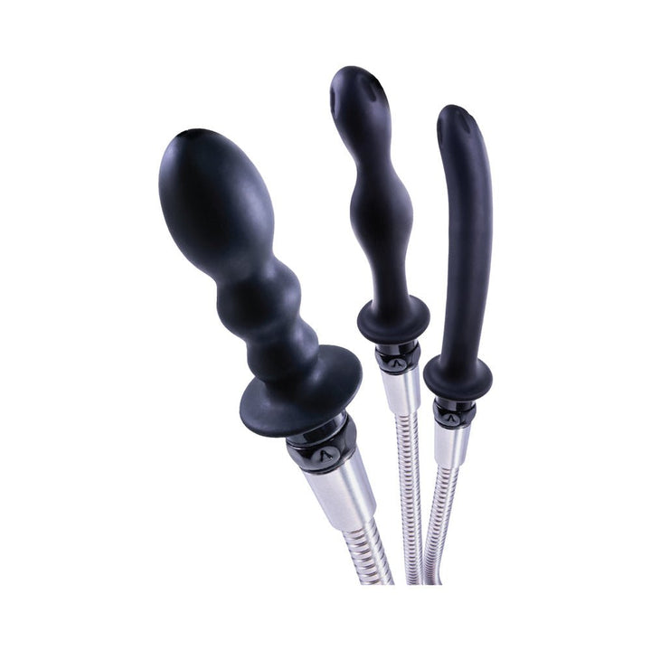 Three black silicone nozzles with varied shapes attached to flexible stainless steel hoses for a hydro douche kit.