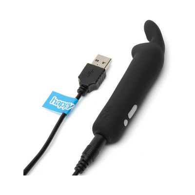 Black silicone Happy Rabbit rechargeable bullet vibrator with USB charging cable on white background.
