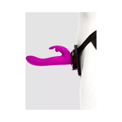 Purple Happy Rabbit vibrating strap-on harness worn on a white mannequin with adjustable black straps.