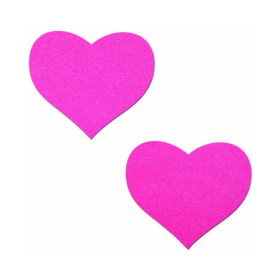 Pair of neon pink heart-shaped adhesive pasties on a white background