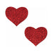 Pair of red glitter heart-shaped pasties with a sparkling finish on a white background.