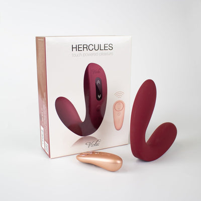 Hercules Remote C-shape Vibrating Plug in wine red with rose gold remote and packaging on white background.