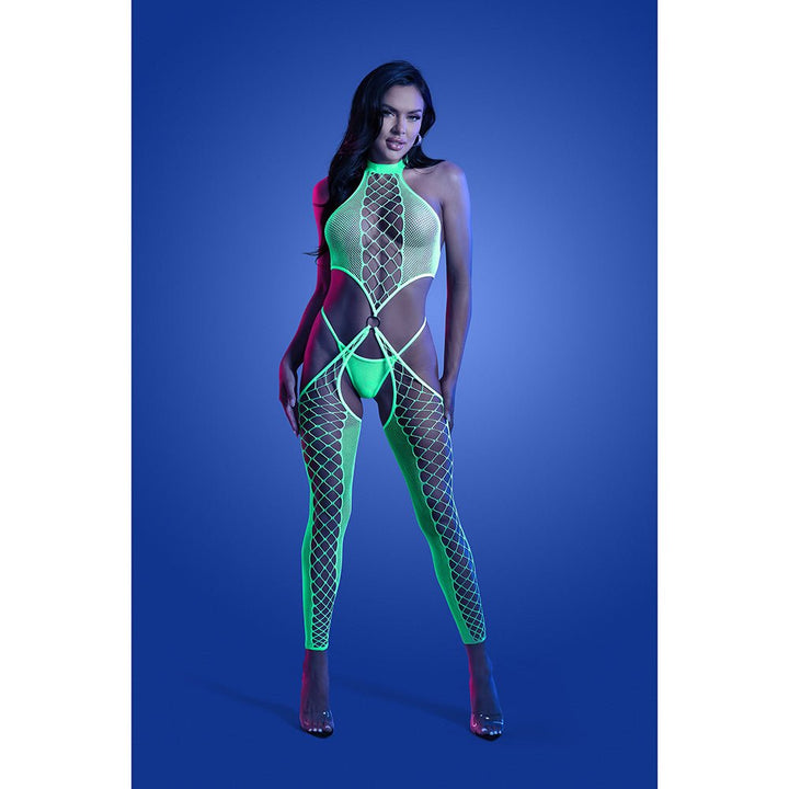 Model wearing neon green high neck fishnet bodystocking with O-ring details and matching G-string under blue lighting background.