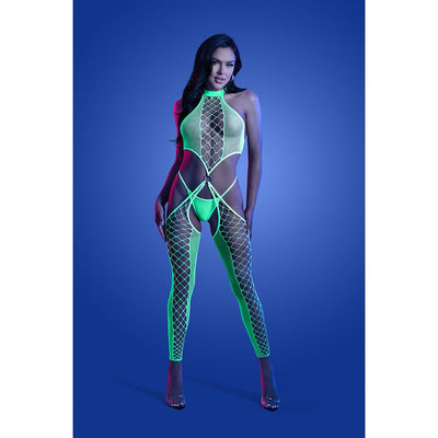 Model wearing neon green high neck fishnet bodystocking with O-ring details and matching G-string under blue lighting background.