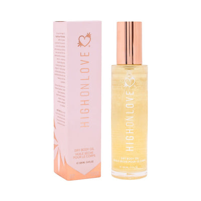 Highonlove Dry Body Oil Spray in clear bottle with rose gold cap next to pink and orange branded packaging box.