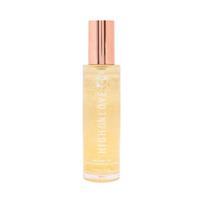 Highonlove Dry Body Oil Spray in clear bottle with rose gold cap, nourishing skin and hair with a lightweight formula.