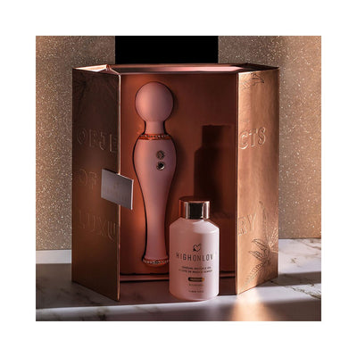 HighOnLove Objects of Luxury Gift Set with rose gold body wand and sensual massage oil in elegant packaging on marble surface