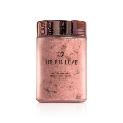 HighOnLove Sensual Bath Salts in a frosted jar with rose gold lid, infused with rosemary and lavender for relaxation.