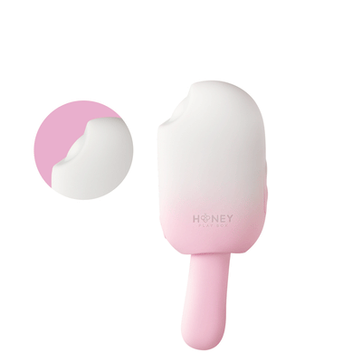 Pink and white Honey Play Box Bite Me cream pop stimulator with bite-mark detail and smooth silicone finish.