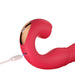 Close-up of red Honey Play Box Joi Thrust 2 vibrator with gold accent, shown charging via USB cable.