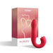 Red Honey Play Box Joi Thrust 2 app-controlled thrusting vibrator and clit licker with packaging in the background.