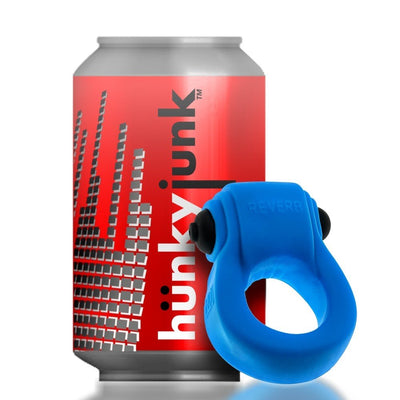 Blue Hunkyjunk Revring cockring with bullet vibrator shown next to a red can for size comparison.