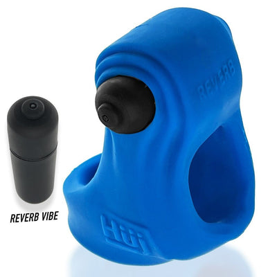 Blue Hunkyjunk Revsling cock and ball sling with removable black bullet vibrator beside it.