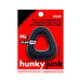 Black trapezoid-shaped lifter cockring on red Hunkyjunk branded packaging with product details and logo.