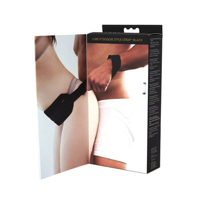 Packaging of I Like It Doggie Style Strap showing a couple demonstrating the adjustable padded harness in black.
