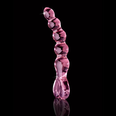Pink glass beaded massager with curved, textured design and heart-shaped handle on black background.