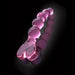 Pink hand-crafted glass massager with beaded shaft and heart-shaped handle on a black reflective surface.
