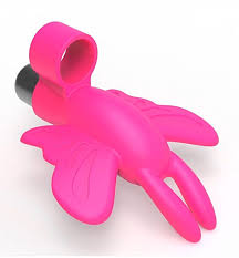 Pink silicone butterfly-shaped finger vibrator with wings and antennae, compact and travel-friendly design.