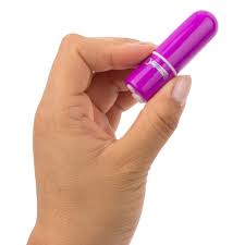 Hand holding a compact purple bullet vibrator with a smooth, sleek design.