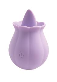 Lavender rose-shaped clitoral stimulator with soft silicone petals and a tongue-like tip, featuring a power button on the base.