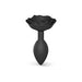 Black silicone anal plug with a rose-shaped base and smooth tapered design for comfortable use.