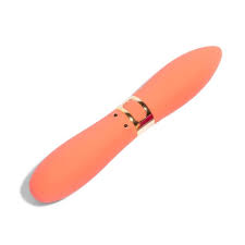 Coral-colored double-ended bullet vibrator with sleek design and gold accent ring.