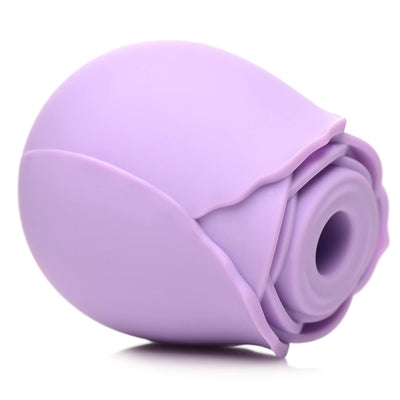 Purple silicone rose-shaped clitoral suction stimulator with a smooth, petal-like design.
