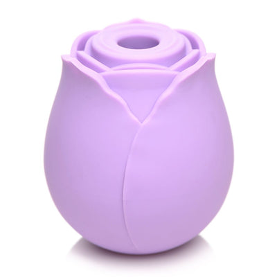 Compact lavender silicone rose-shaped clitoral suction stimulator with a central suction opening.