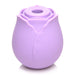 Compact lavender silicone rose-shaped clitoral suction stimulator with a central suction opening.
