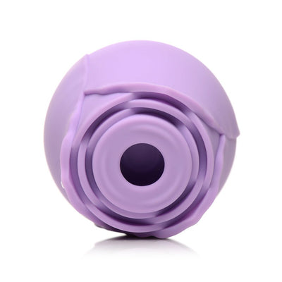 Close-up of a lavender silicone rose-shaped clitoral suction stimulator with a central suction hole.
