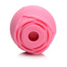 Pink rose-shaped silicone clitoral suction stimulator with a central suction hole and layered petal design.