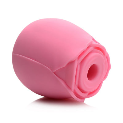 Pink rose-shaped silicone clitoral suction stimulator with a central suction opening and smooth petals design.