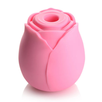Pink rose-shaped silicone clitoral suction stimulator with a central suction hole and smooth petal design.