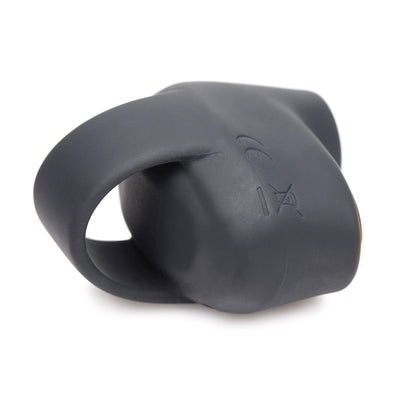 Compact black silicone mini suction stimulator with finger loop, designed for ergonomic and discreet use.