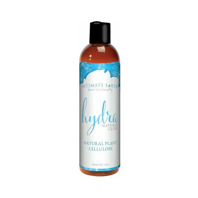 Bottle of Intimate Earth Hydra water-based lubricant with natural plant cellulose in a 2 oz amber container and blue label.