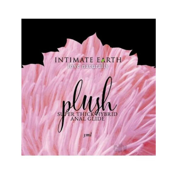 Intimate Earth Plush Super Thick Hybrid Anal Glide sample packet with soft pink textured background design.