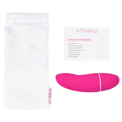 Pink Intimina KIRI personal massager with white storage pouch and user manual on white background.