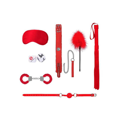 Red introductory bondage kit with blindfold, collar, leash, feather tickler, flogger, handcuffs, ball gag, and sex dice on white background.