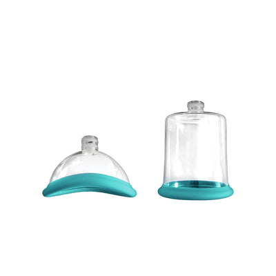 Two interchangeable clear suction cups with teal silicone bases for the Inya Pump And Vibe, shown on white background.
