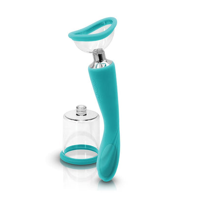 Teal dual-function pump and vibrator with interchangeable clear suction cups for versatile body use.