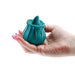 Hand holding dark teal rosebud-shaped silicone clitoral stimulator with a pointed tip and power button.