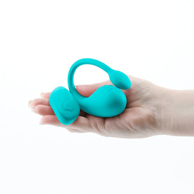 Teal Inya Venus remote-controlled silicone vibrator held in hand, showing compact size and smooth texture.