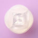 Top view of the translucent iroha Petit LILY Clear personal massager on a lavender background.