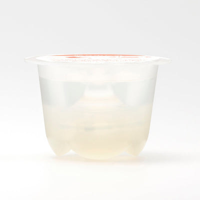 Transparent single-use container with a clear, flower-shaped iroha Petit LILY inside on a white background.